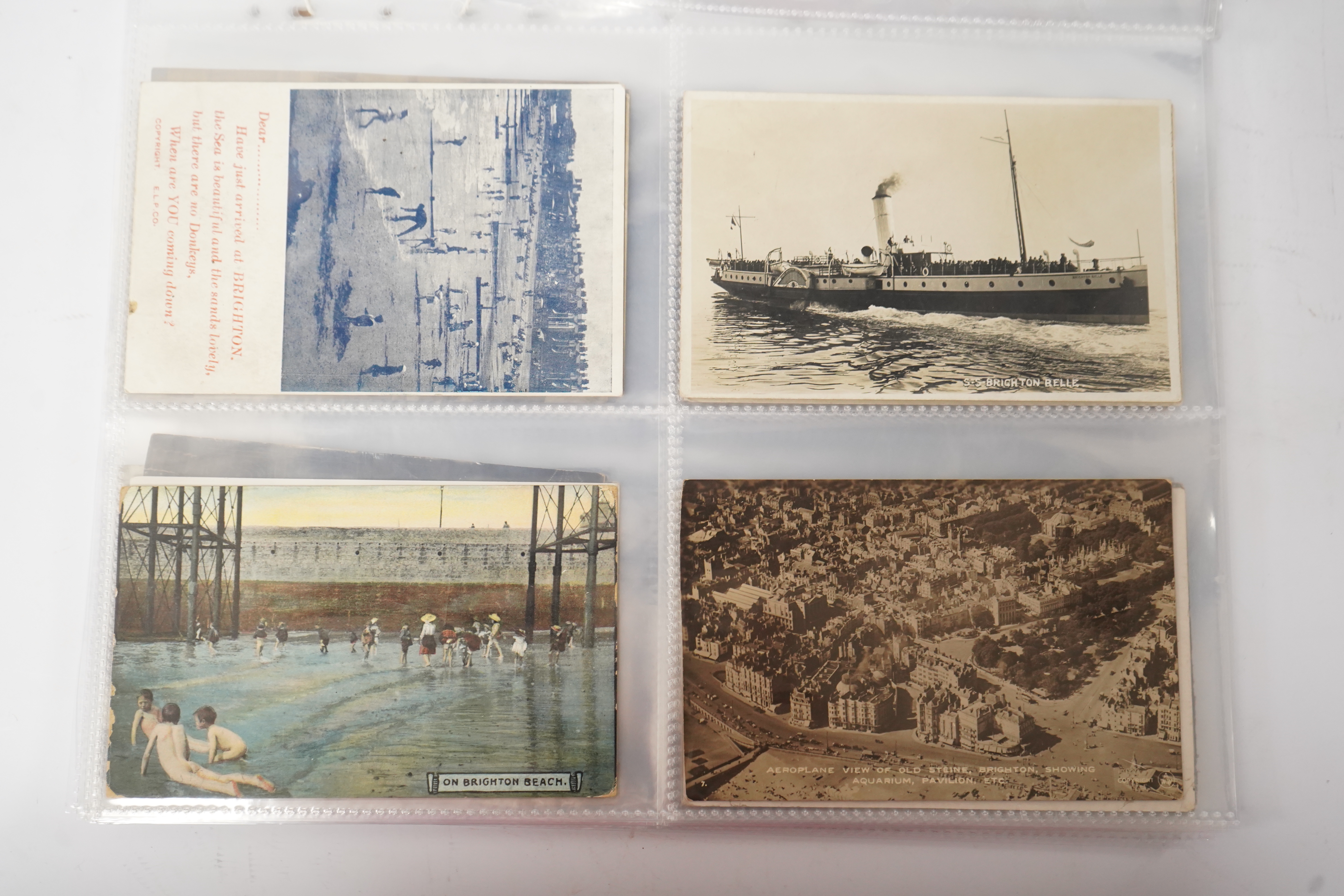 Brighton & Hove interest; a collection of one hundred and twelve assorted vintage postcards, mostly pre WW1, including novelty, shopfronts and Albion football matches